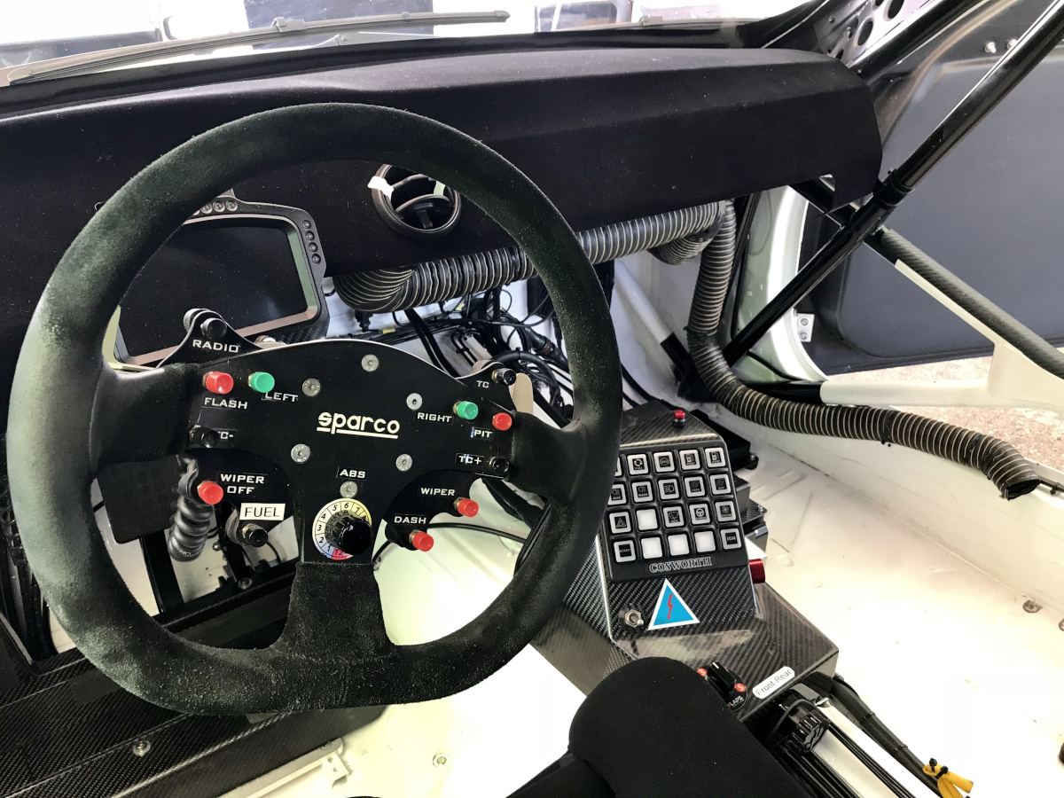 Bosch Motorsport Abs M5 12-Position Rotary Function Switch In A Race Car Cockpit, Used To Dial Abs Intervention Level Up Or Down To Match Grip